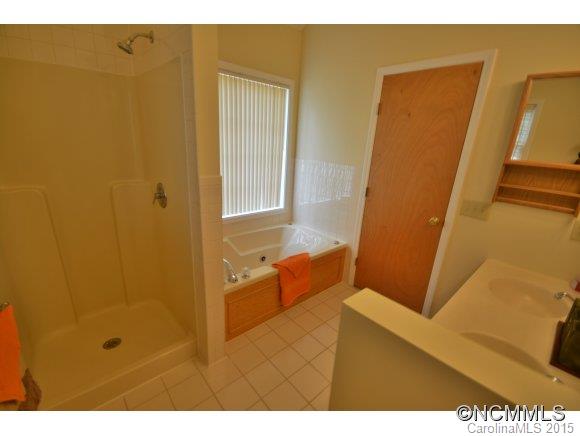 164 Thistle Ridge Clyde, NC 28721 - Photo 11 of 16 a bathroom with a tub