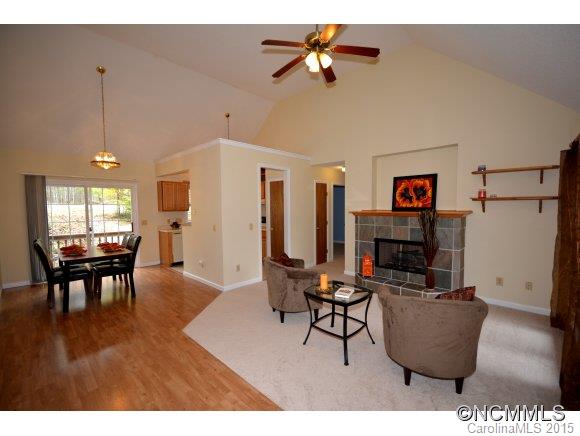 164 Thistle Ridge Clyde, NC 28721 - Photo 15 of 16 a living room with furniture and a wooden floor