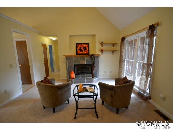 164 Thistle Ridge Clyde, NC 28721 - Photo 3 of 16 a living room with furniture and a fireplace