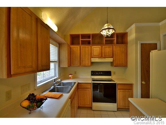 164 Thistle Ridge Clyde, NC 28721 - Photo 5 of 16 a kitchen with a sink cabinets and stainless steel appliances