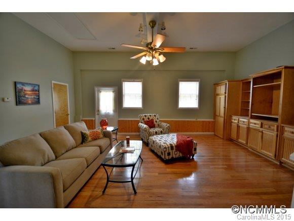 164 Thistle Ridge Clyde, NC 28721 - Photo 7 of 16 a living room with furniture and a wooden floor