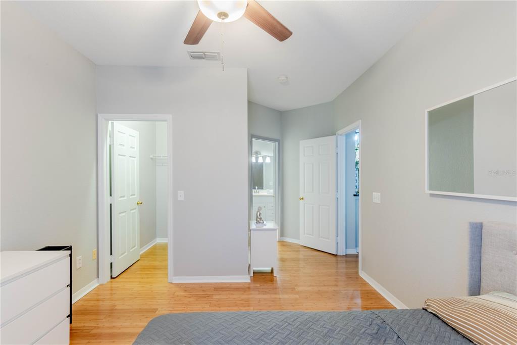 3611 Conroy Road, Unit 834 Orlando, FL 32839 - Photo 15 of 41 a bedroom with a bed and a chandelier