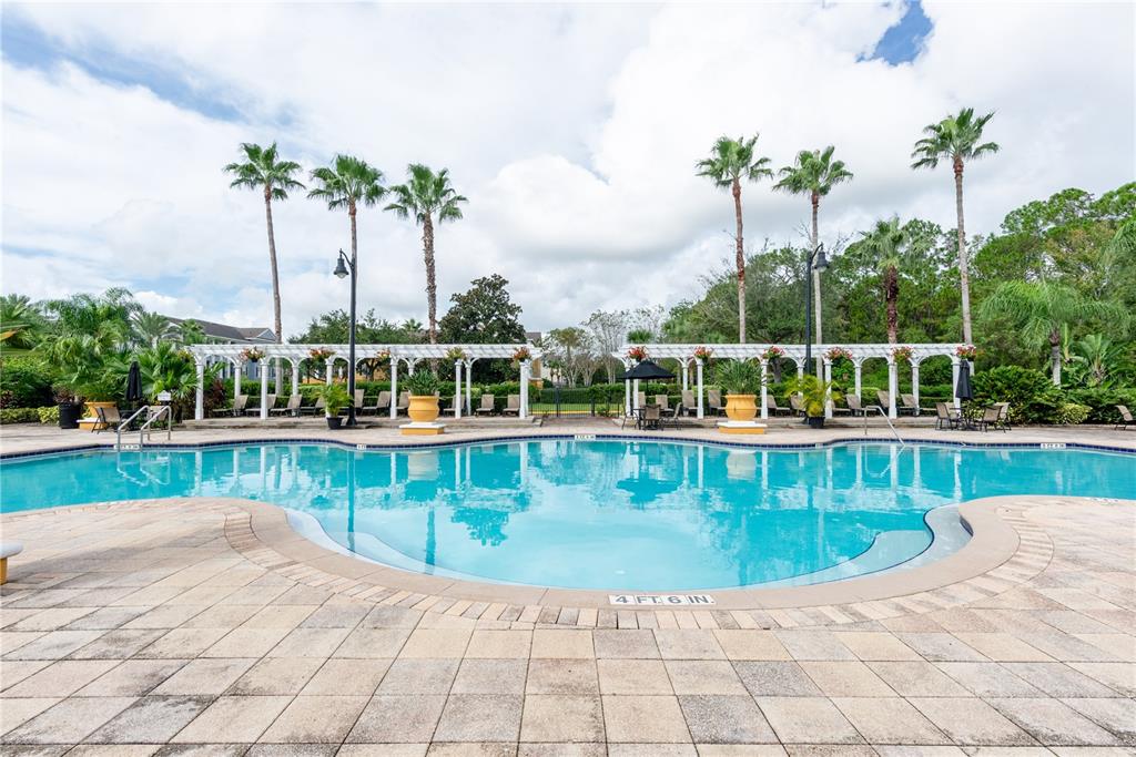 3611 Conroy Road, Unit 834 Orlando, FL 32839 - Photo 34 of 41 a view of a swimming pool with a patio