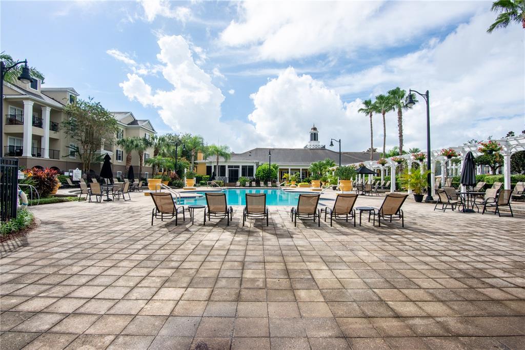 3611 Conroy Road, Unit 834 Orlando, FL 32839 - Photo 35 of 41 a view of a patio with dining table and chairs