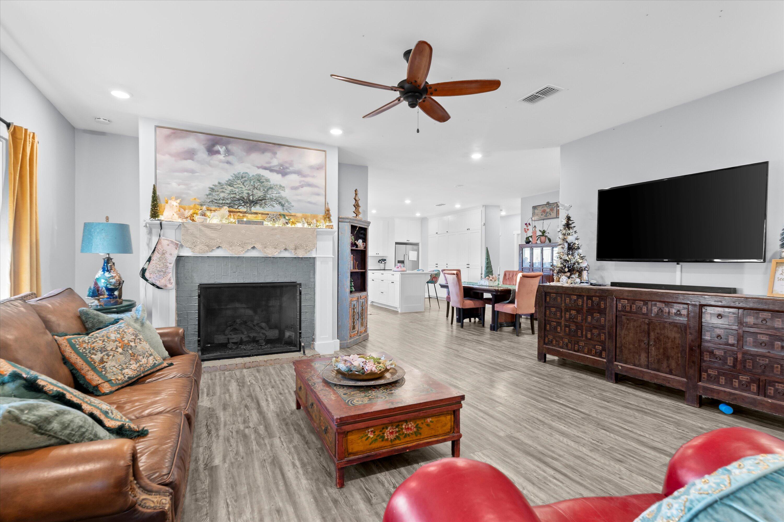3370 Drill Stem Road Levelland, TX 79336 - Photo 15 of 59 a living room with furniture fireplace and flat screen tv
