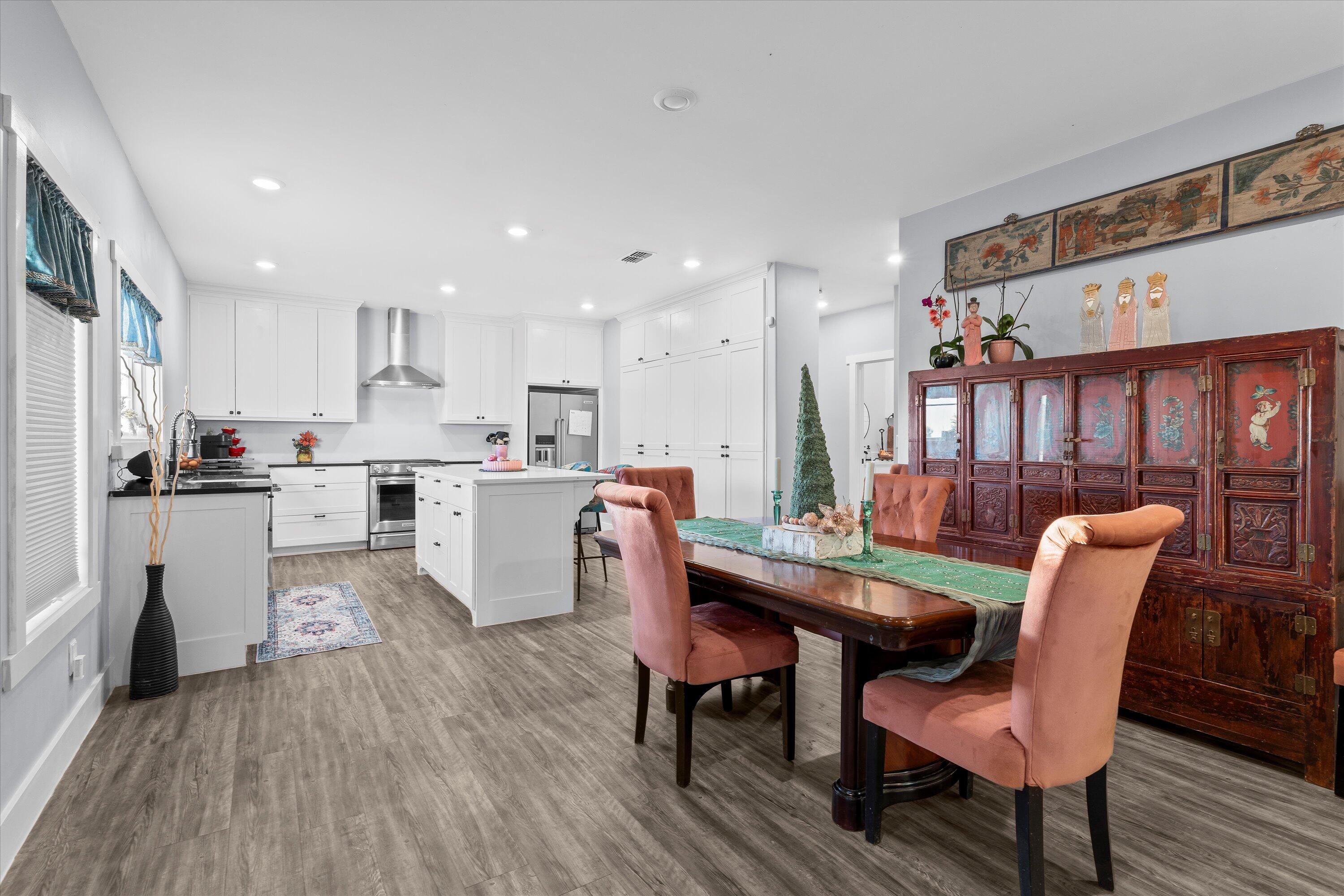 3370 Drill Stem Road Levelland, TX 79336 - Photo 17 of 59 a kitchen with a dining table chairs and white cabinets