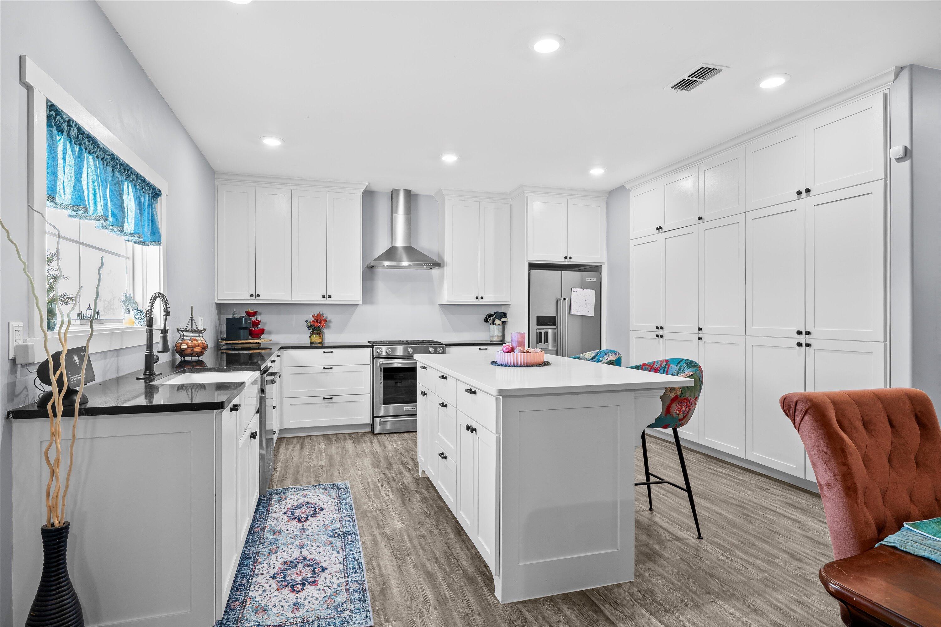 3370 Drill Stem Road Levelland, TX 79336 - Photo 21 of 59 a kitchen that has a lot of cabinets in it with granite countertop appliances a sink and a island