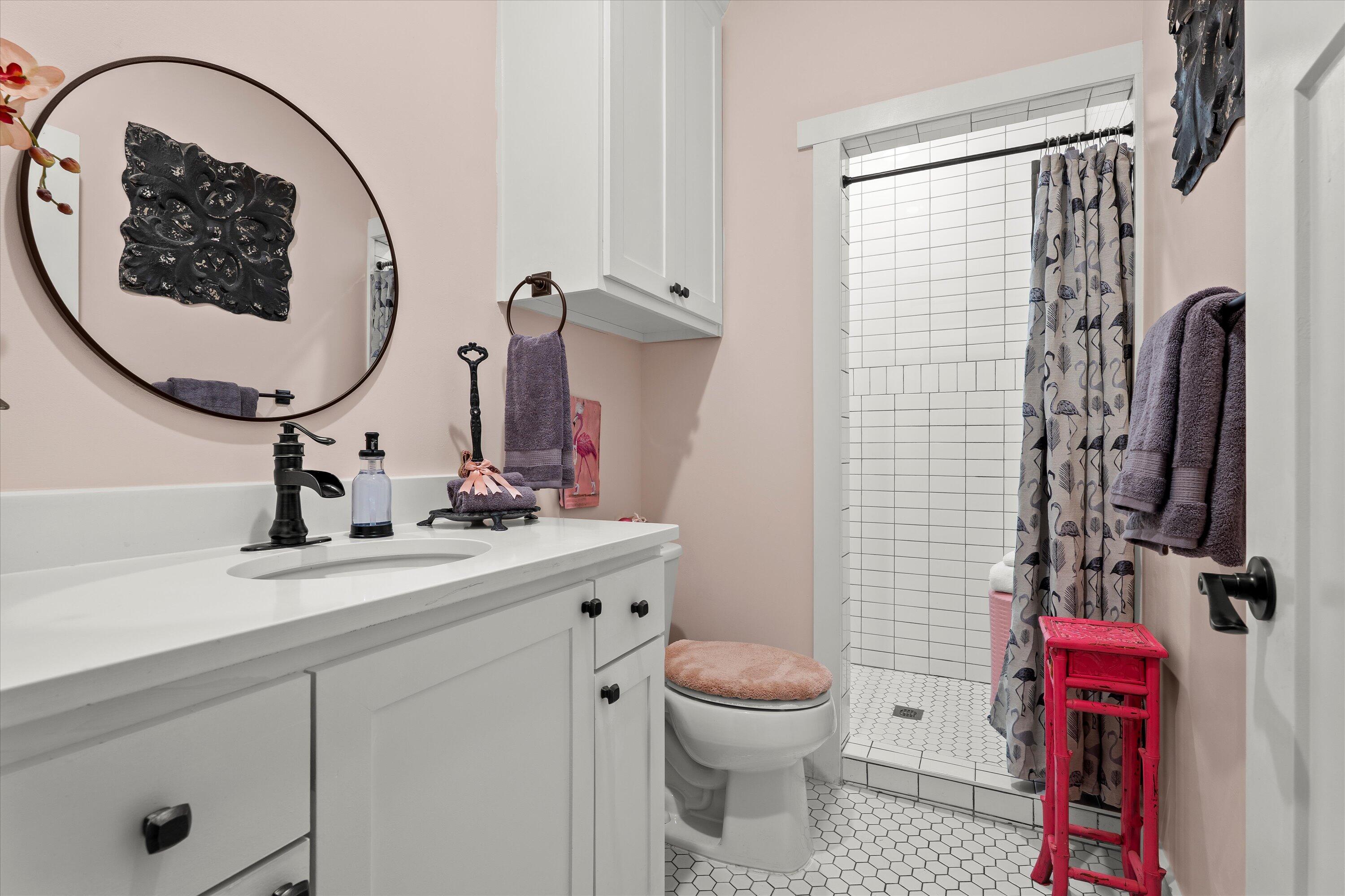 3370 Drill Stem Road Levelland, TX 79336 - Photo 25 of 59 a bathroom with a sink toilet and mirror