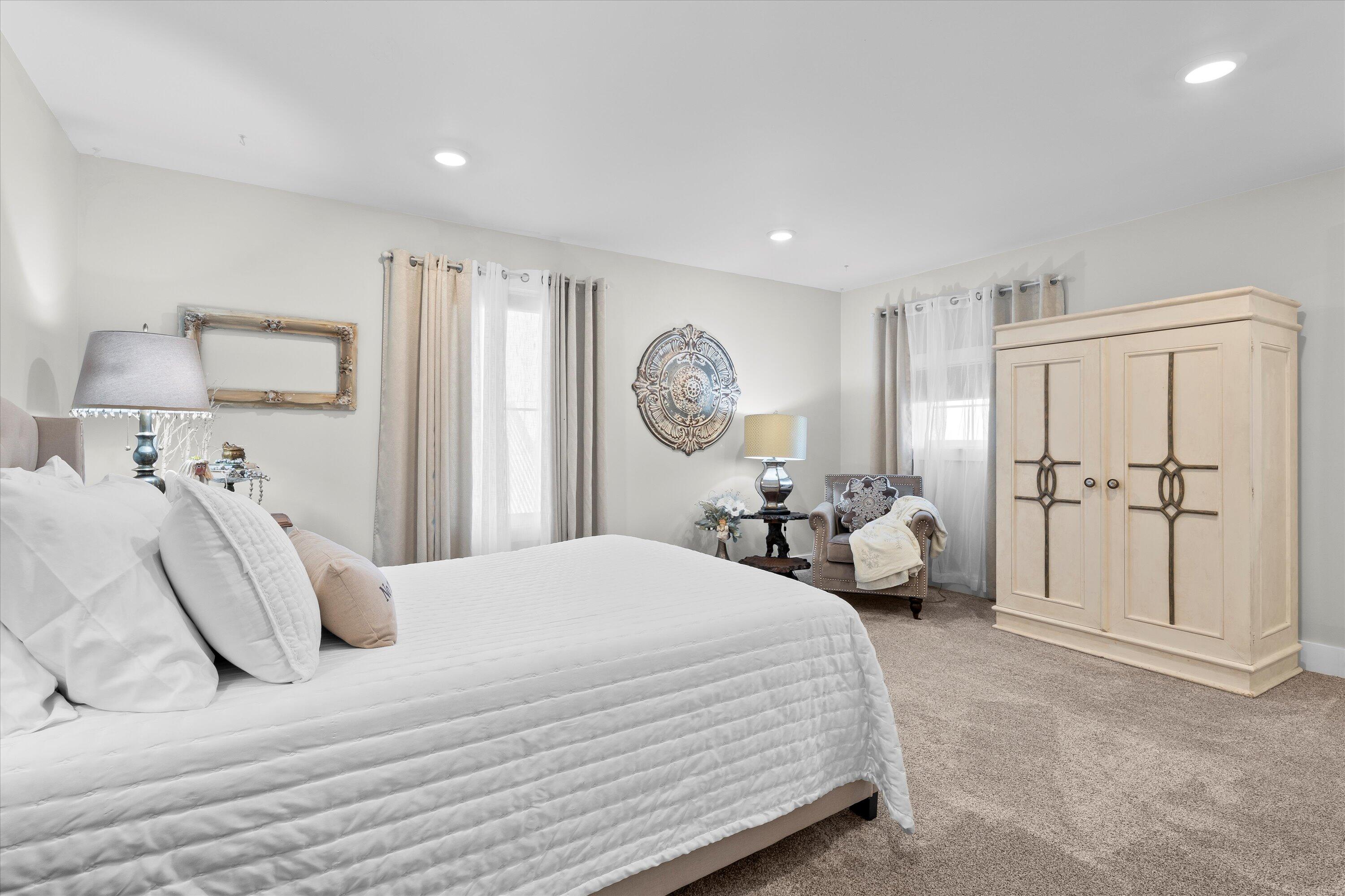 3370 Drill Stem Road Levelland, TX 79336 - Photo 31 of 59 a bedroom with a bed and a lamp