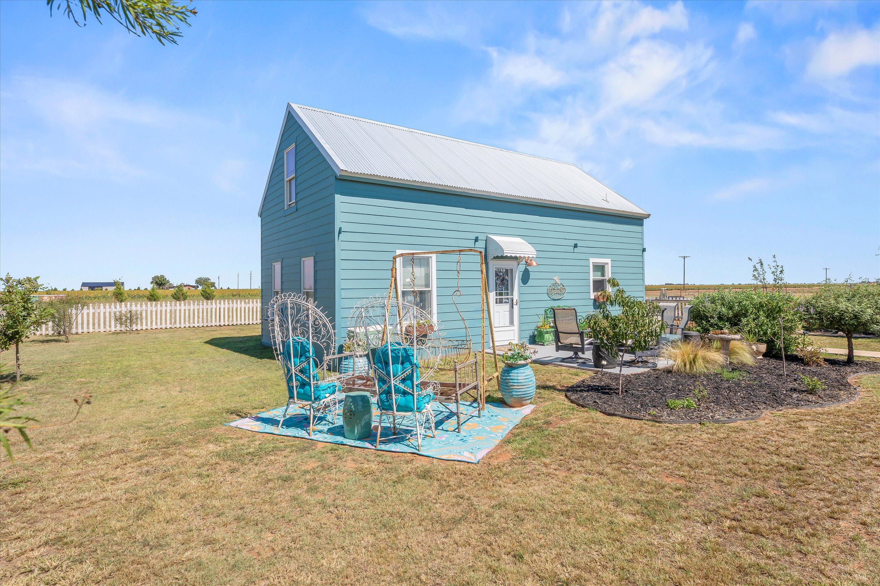 3370 Drill Stem Road Levelland, TX 79336 - Photo 39 of 59 a front view of a house with swimming pool and seating space