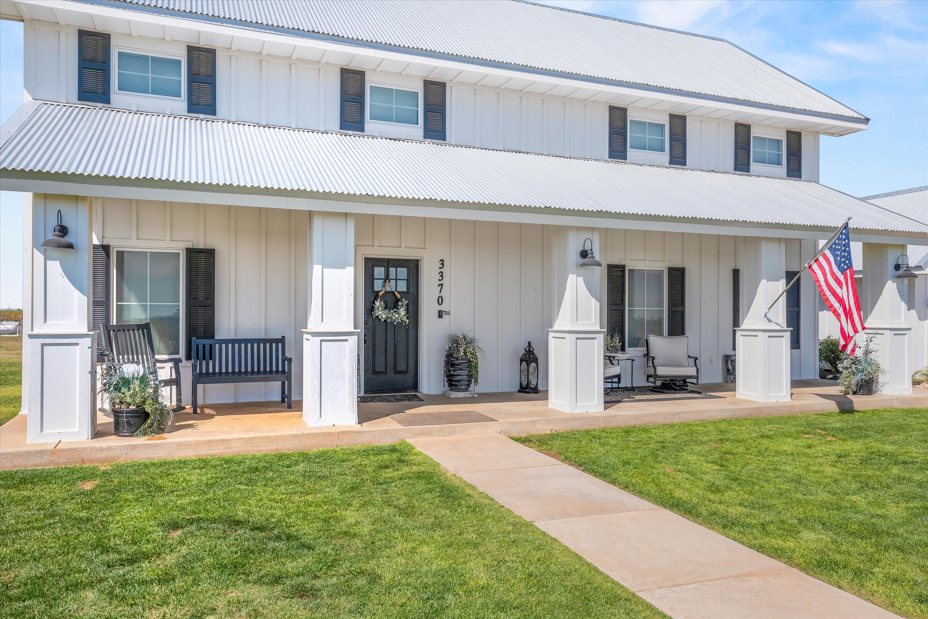 3370 Drill Stem Road Levelland, TX 79336 - Photo 5 of 59 a view of a house with a swimming pool and a yard