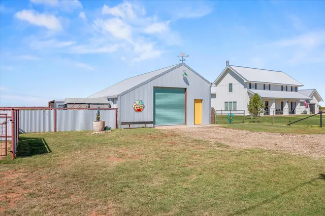 a view of a bedroom with washer and dryer