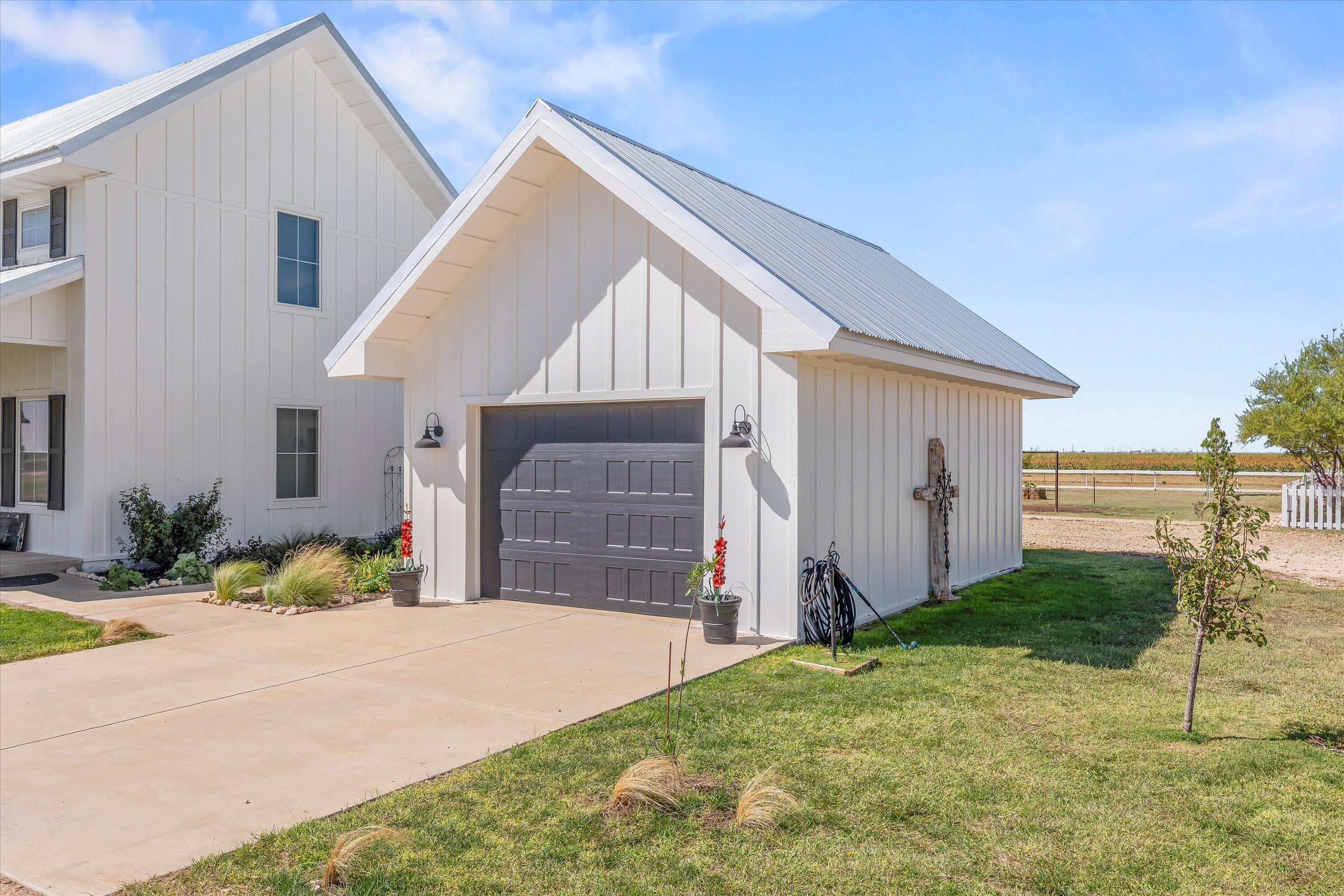 3370 Drill Stem Road Levelland, TX 79336 - Photo 8 of 59 a front view of a house with a yard and garage