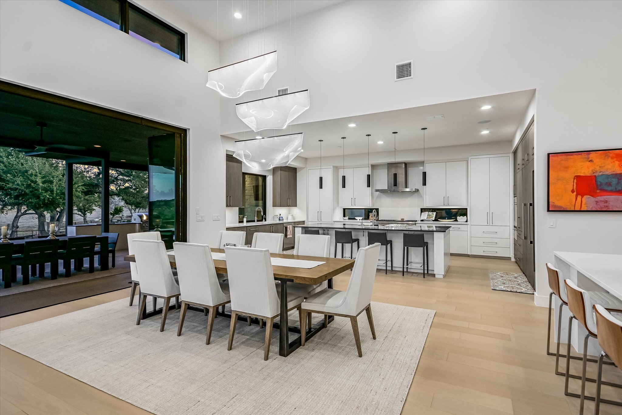 6509 Madrone Tree Lane Austin, TX 78738 - Photo 13 of 40 Dining area with a high ceiling, light wood finished floors, and recessed lighting