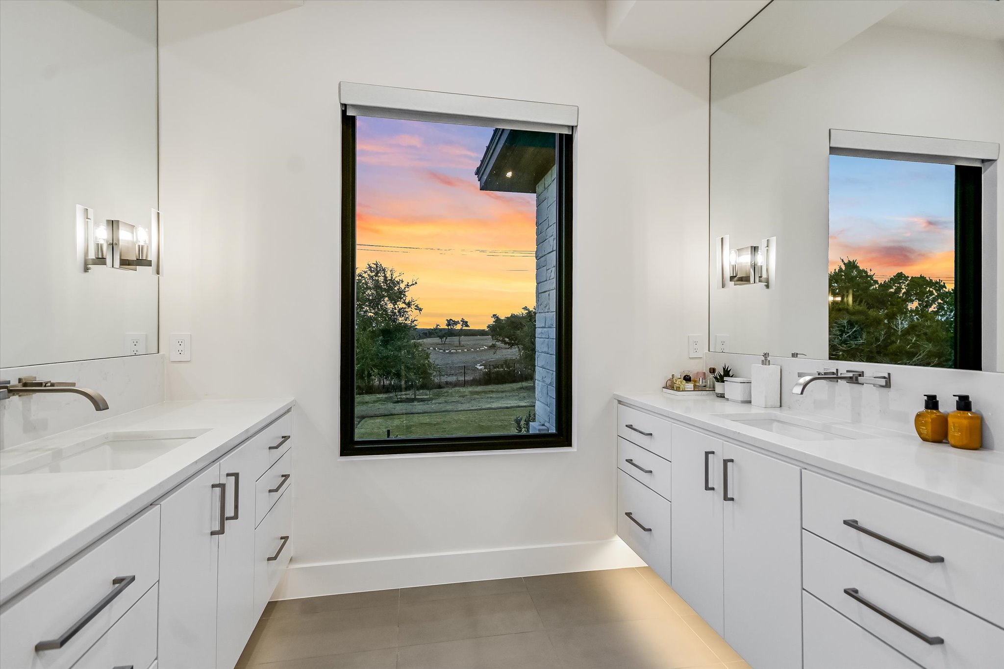 6509 Madrone Tree Lane Austin, TX 78738 - Photo 20 of 40 Full bath with two vanities and light tile patterned flooring