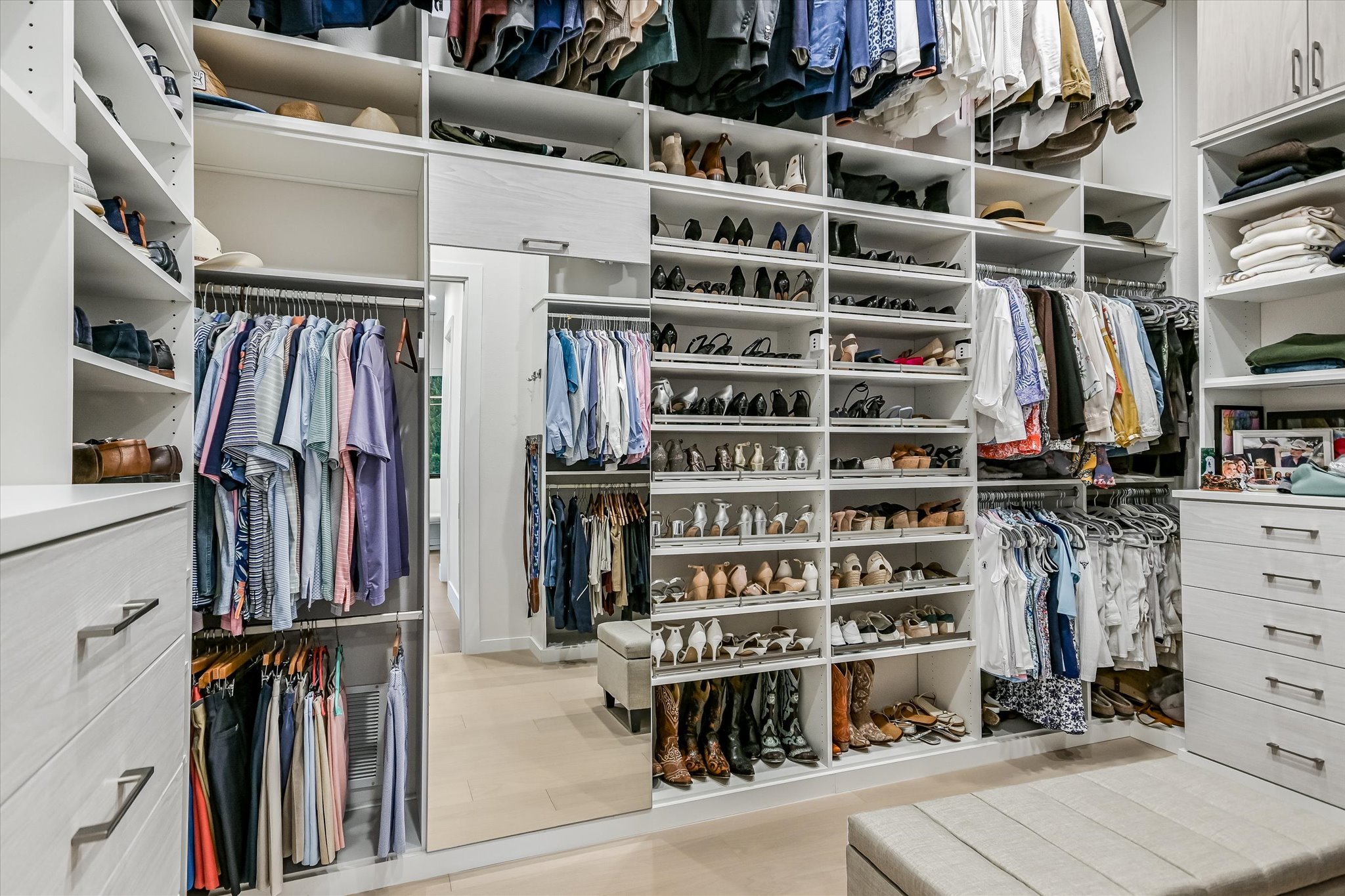 6509 Madrone Tree Lane Austin, TX 78738 - Photo 21 of 40 Primary Walk in closet featuring light wood-type flooring