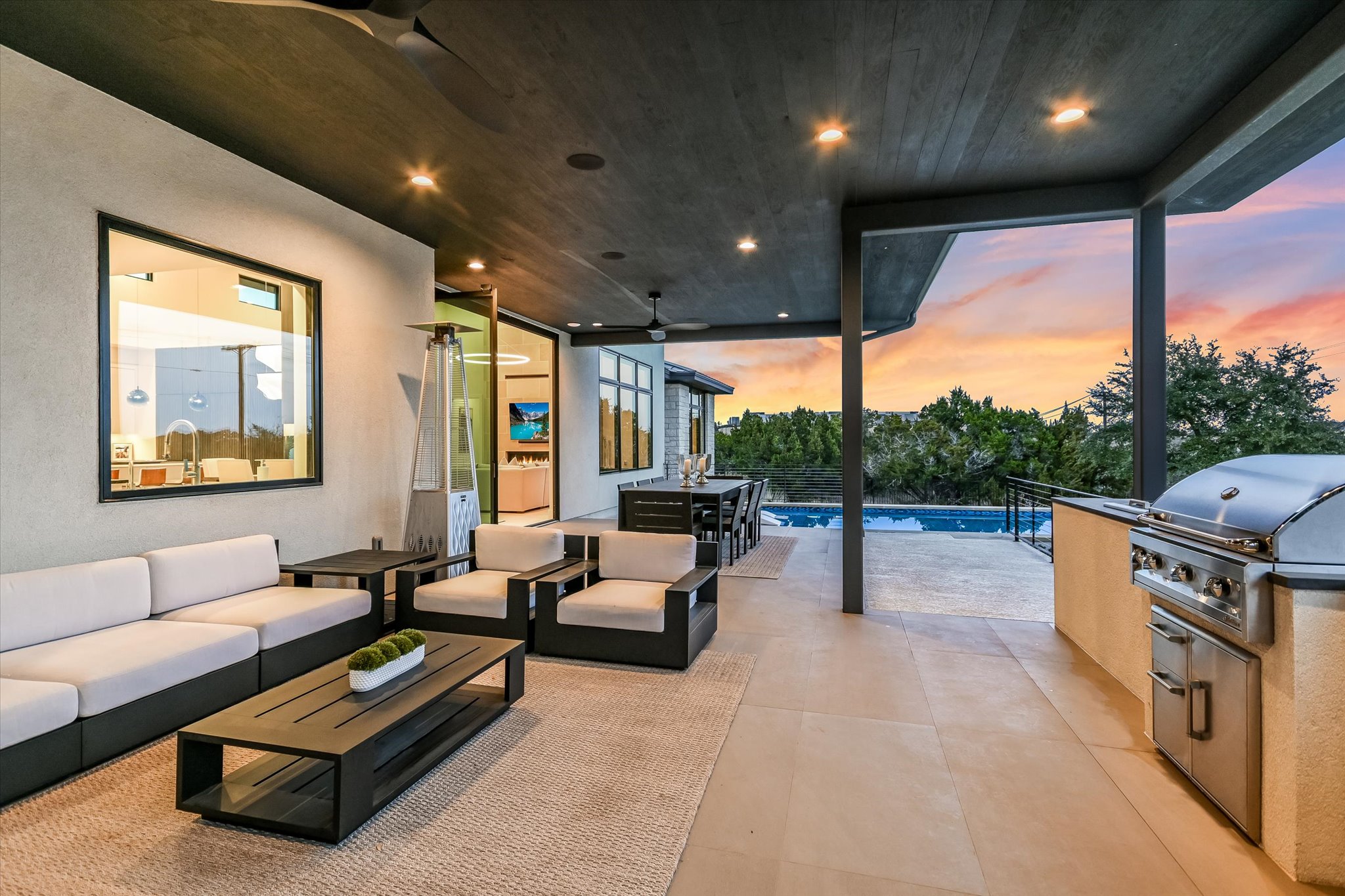 6509 Madrone Tree Lane Austin, TX 78738 - Photo 31 of 40 View of patio with an outdoor kitchen with living area, an outdoor pool, and a ceiling fan