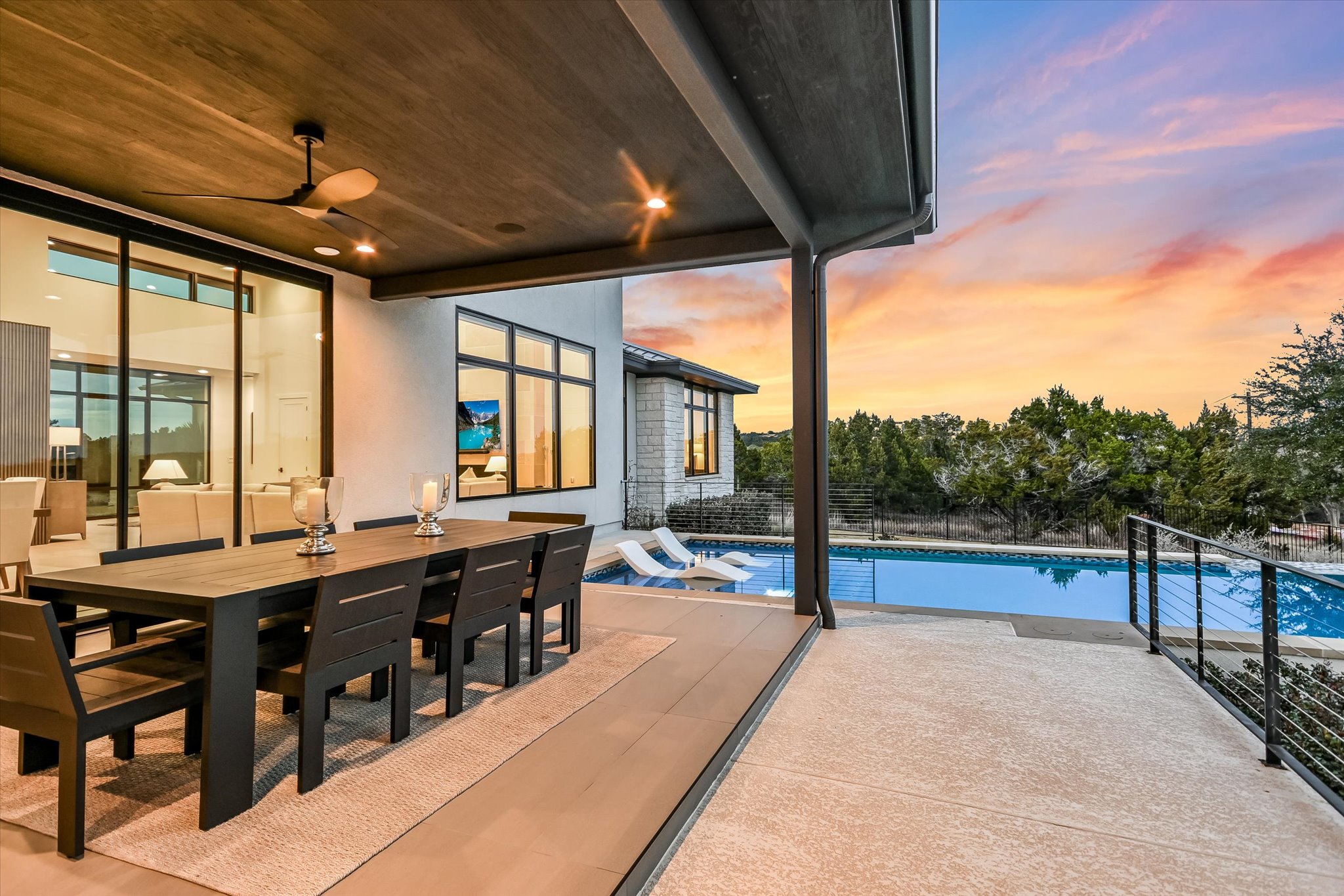 6509 Madrone Tree Lane Austin, TX 78738 - Photo 33 of 40 Pool at dusk featuring an outdoor pool, outdoor dining space, and a patio