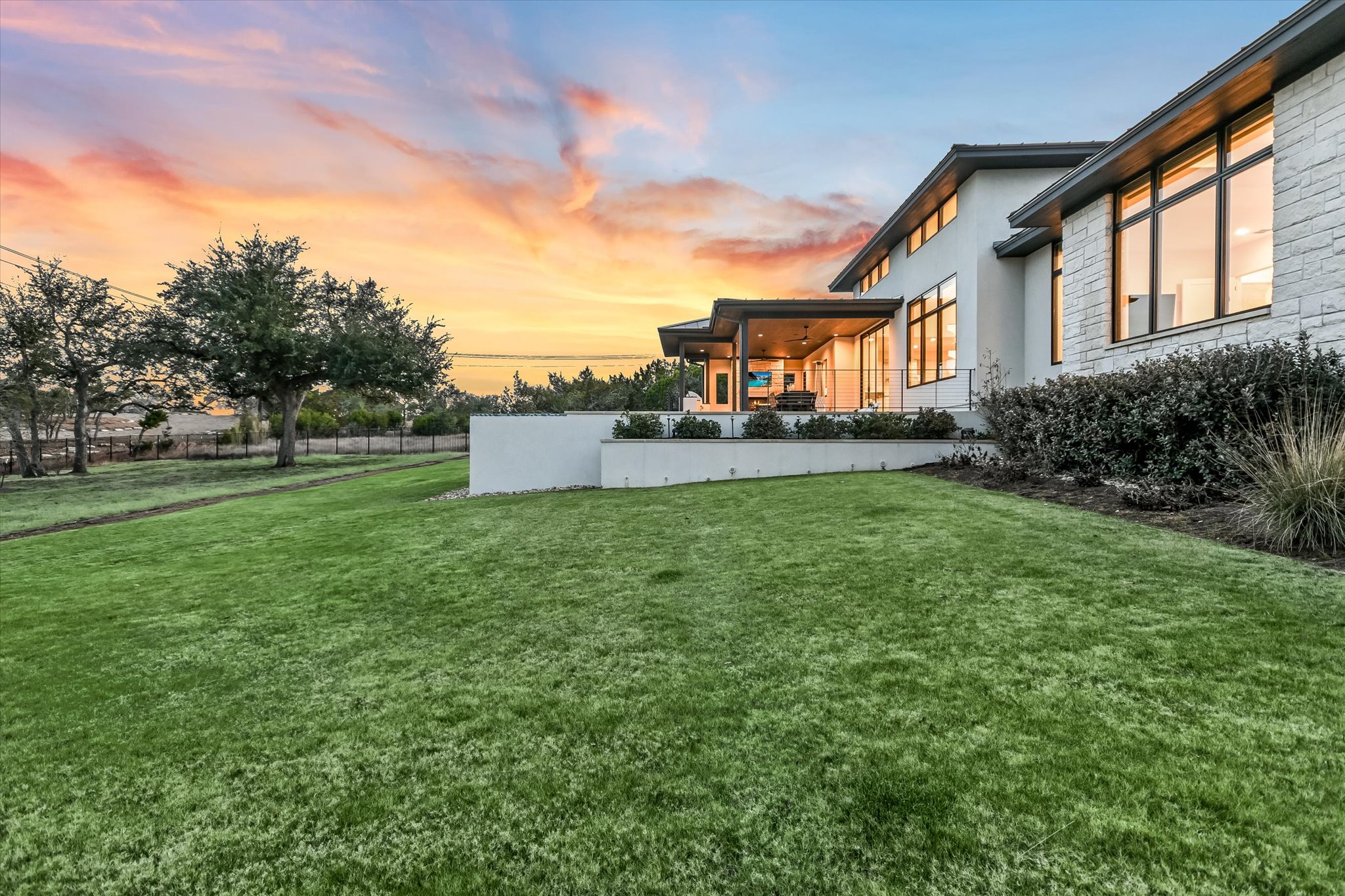 6509 Madrone Tree Lane Austin, TX 78738 - Photo 37 of 40 Yard at dusk with a patio