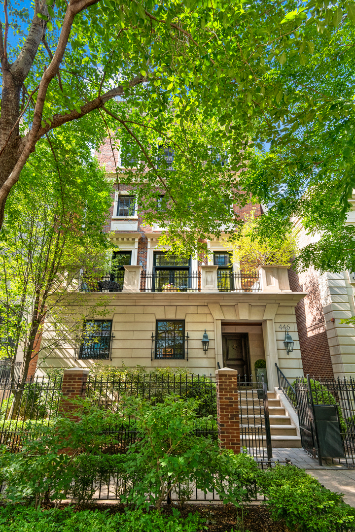 front view of a house with a tree