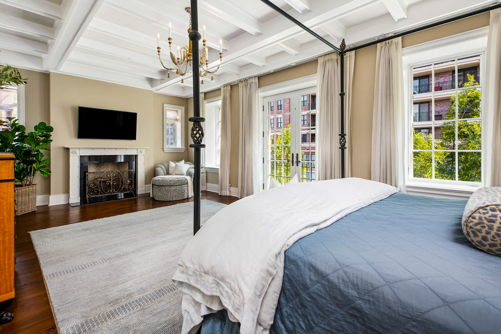 446 West Huron Street Chicago, IL 60654 - Photo 19 of 45 a bedroom with a bed and a flat screen tv