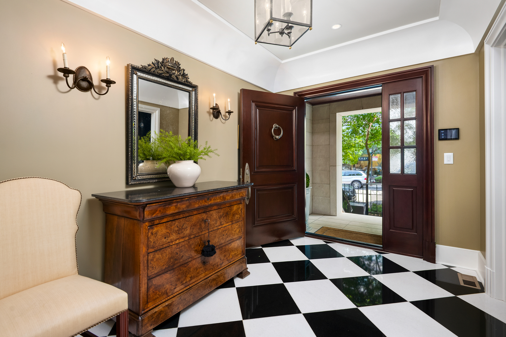 446 West Huron Street Chicago, IL 60654 - Photo 2 of 45 a living room with a black white checkered floor with couches chair and a coffee table