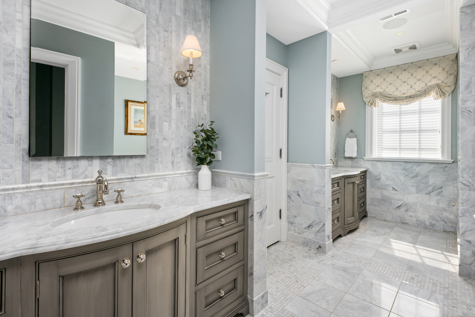 446 West Huron Street Chicago, IL 60654 - Photo 21 of 45 a spacious bathroom with a granite countertop sink a mirror and a