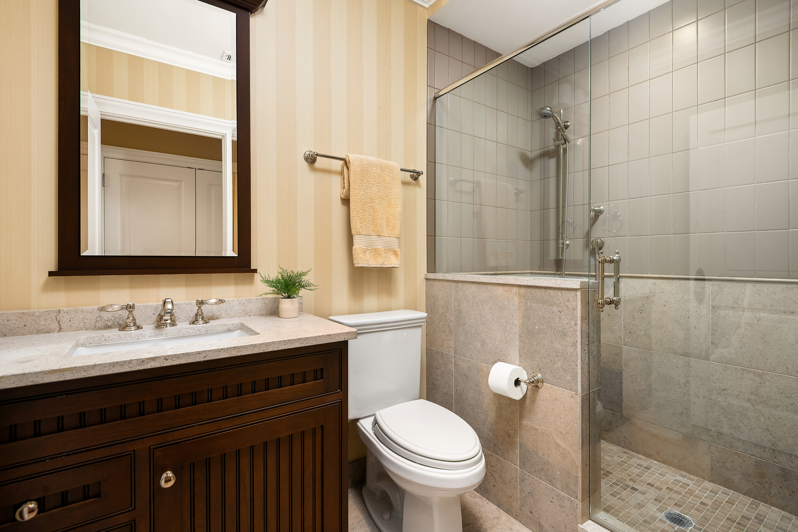 446 West Huron Street Chicago, IL 60654 - Photo 29 of 45 a bathroom with a sink and mirror with toilet