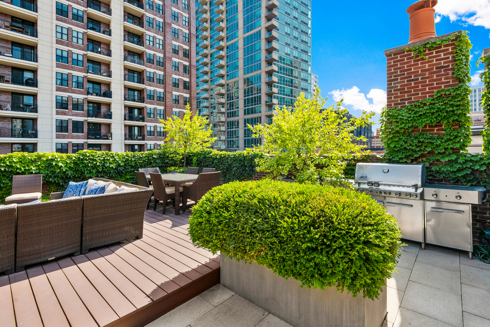 446 West Huron Street Chicago, IL 60654 - Photo 35 of 45 a view of a patio with couches and potted plants