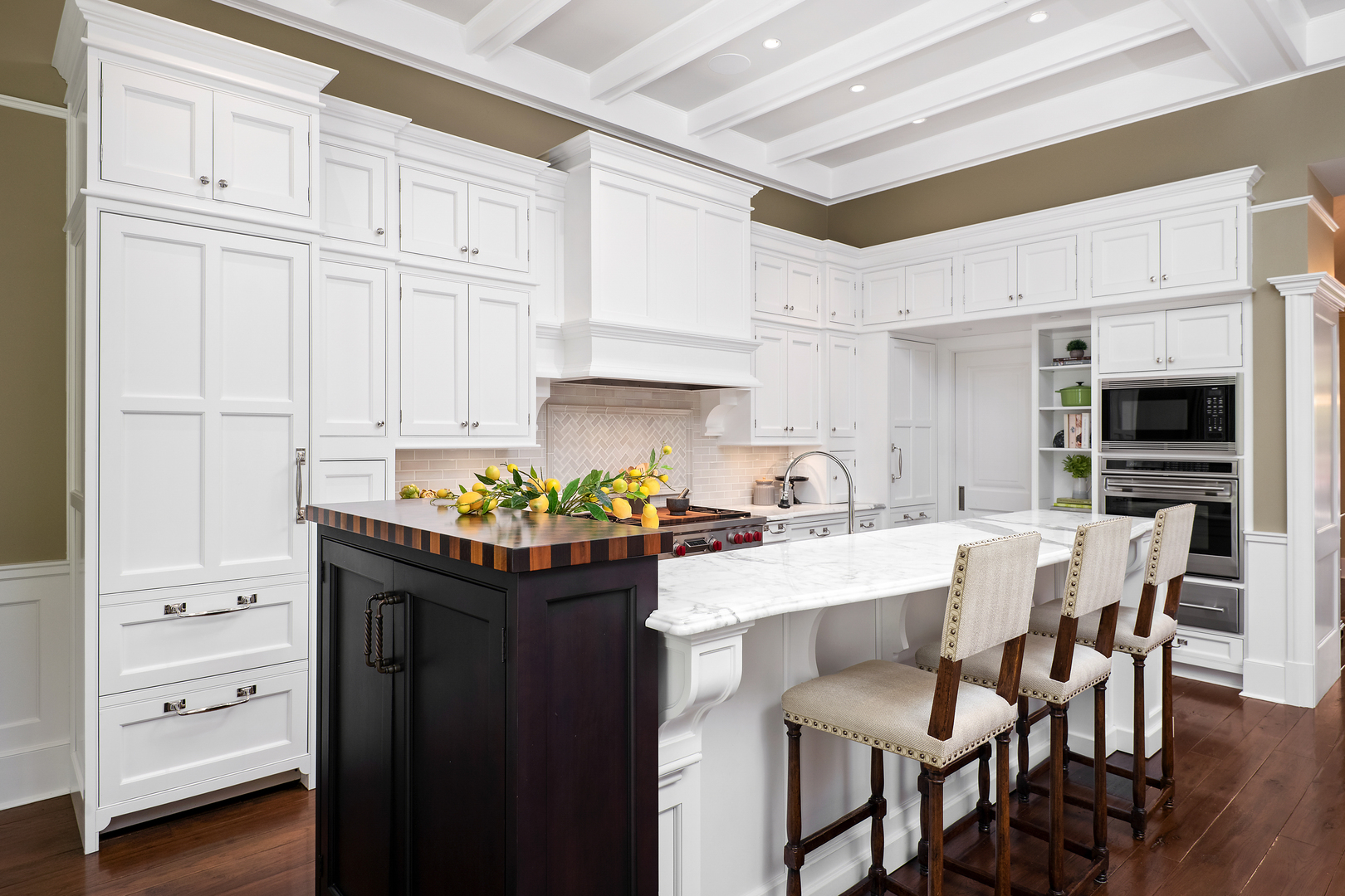 446 West Huron Street Chicago, IL 60654 - Photo 8 of 45 a kitchen with granite countertop a table chairs stove and white cabinets