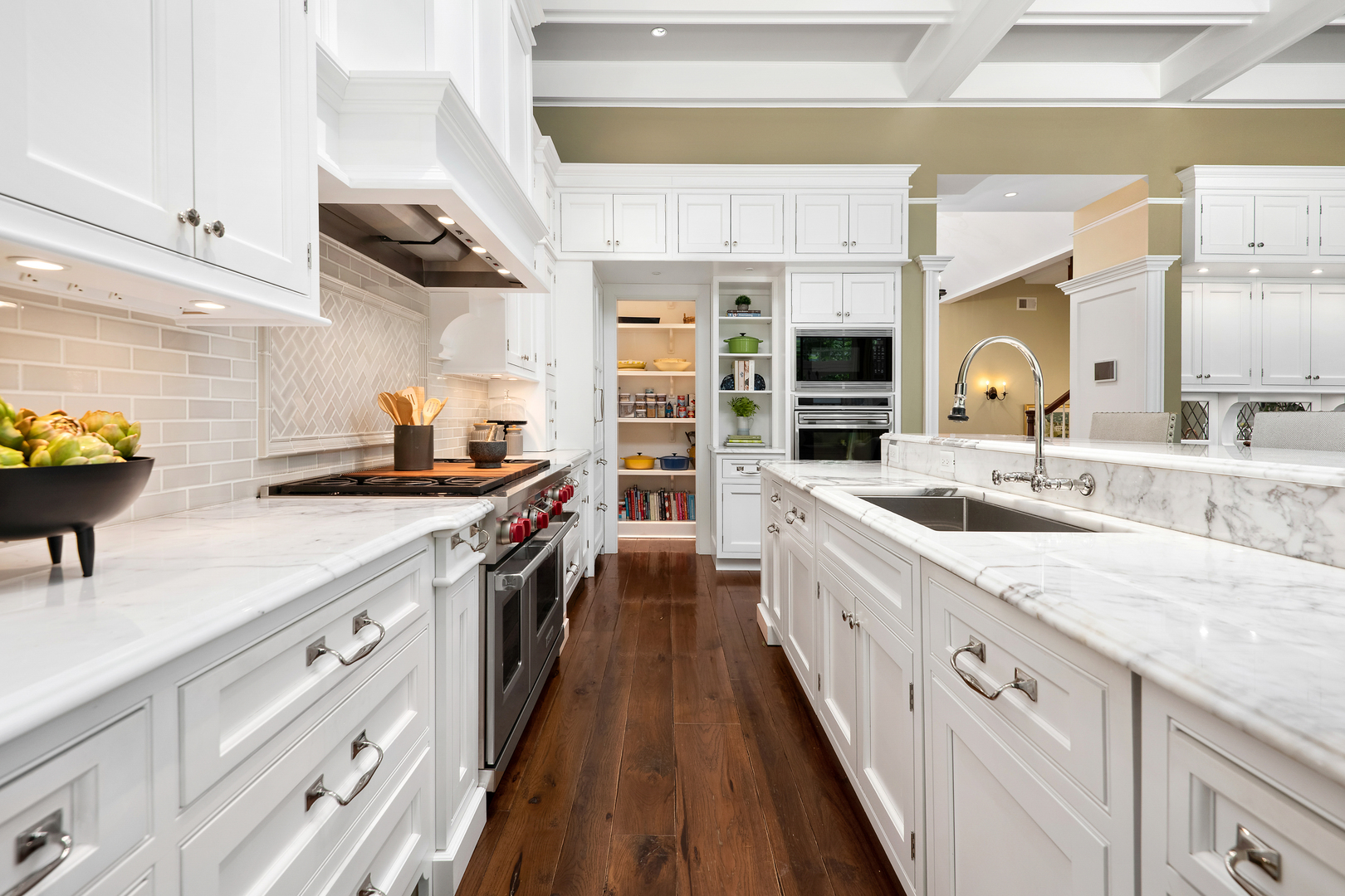 446 West Huron Street Chicago, IL 60654 - Photo 10 of 45 a large kitchen with stainless steel appliances granite countertop a lot of counter space and wooden floors