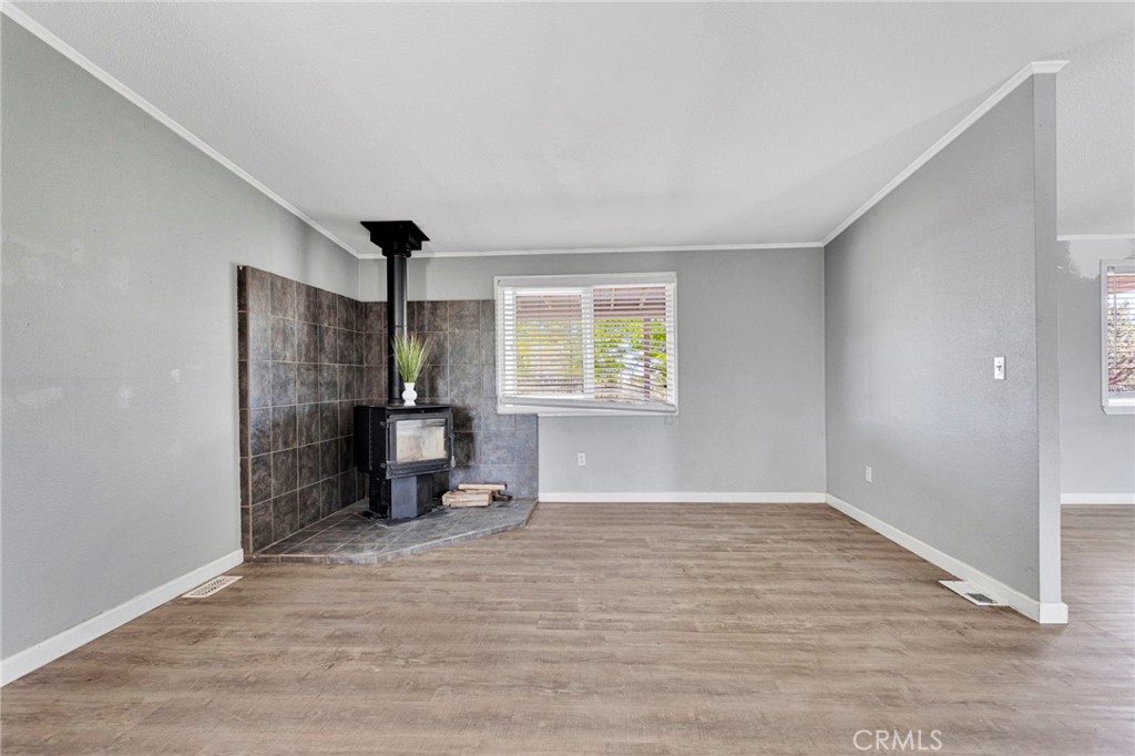 8074 Mira Mar Road Phelan, CA 92371 - Photo 12 of 49 a view of livingroom with hardwood floor and a ceiling fan