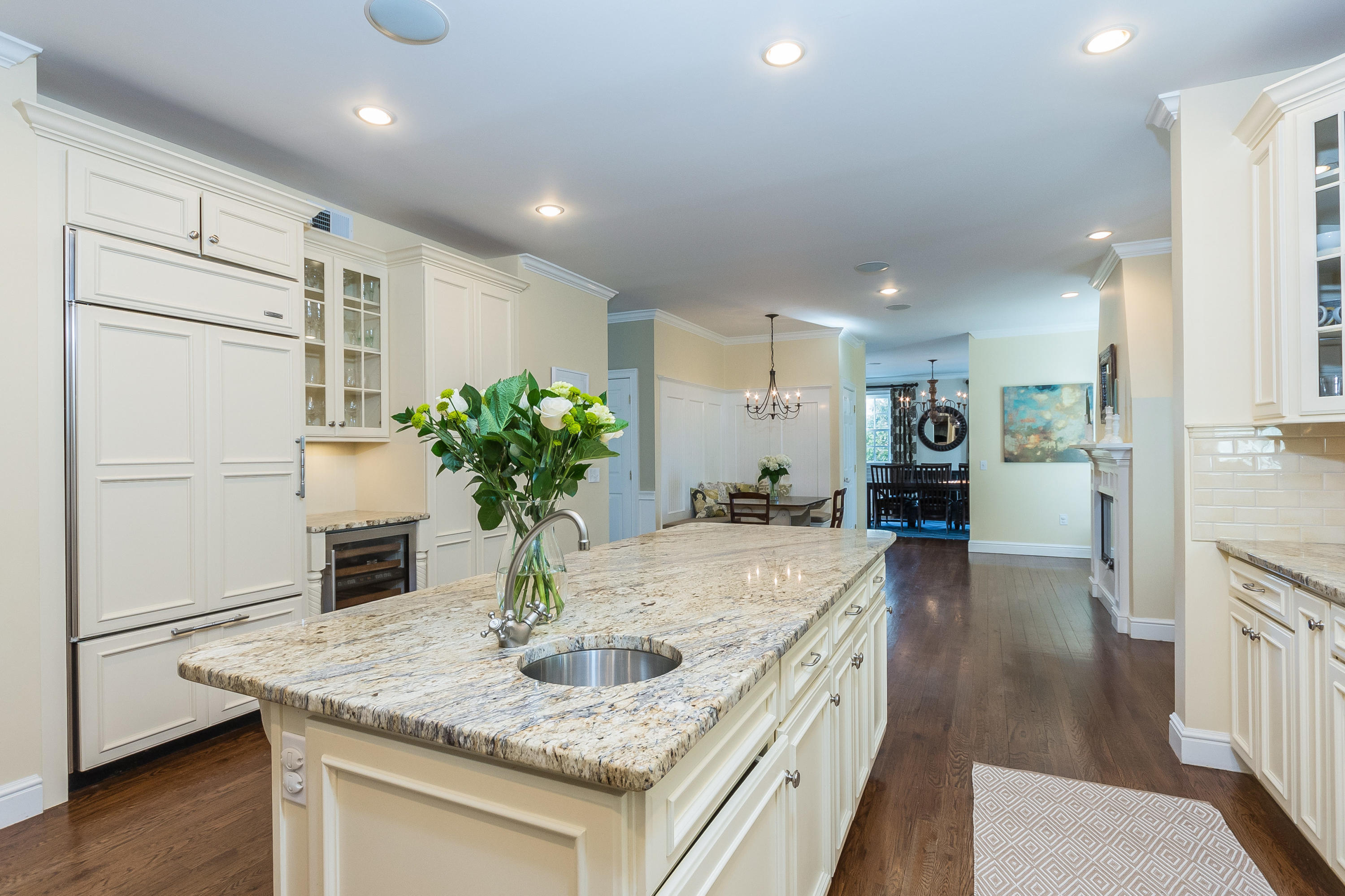 4 Beach Drive Darien, CT 06820 - Photo 15 of 47 a kitchen with kitchen island granite countertop a refrigerator a stove and a sink with wooden floor