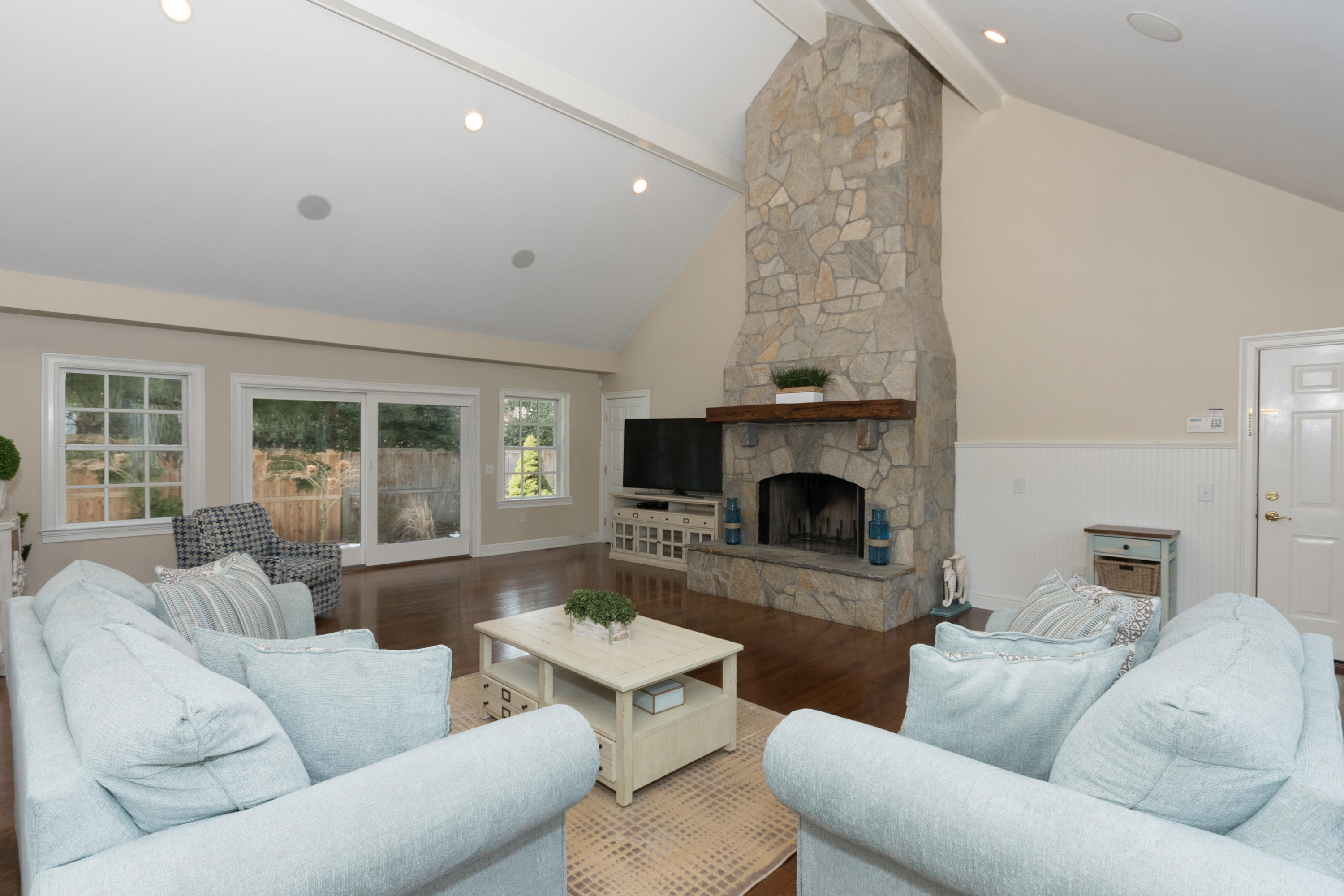 4 Beach Drive Darien, CT 06820 - Photo 20 of 47 a living room with furniture and a fireplace