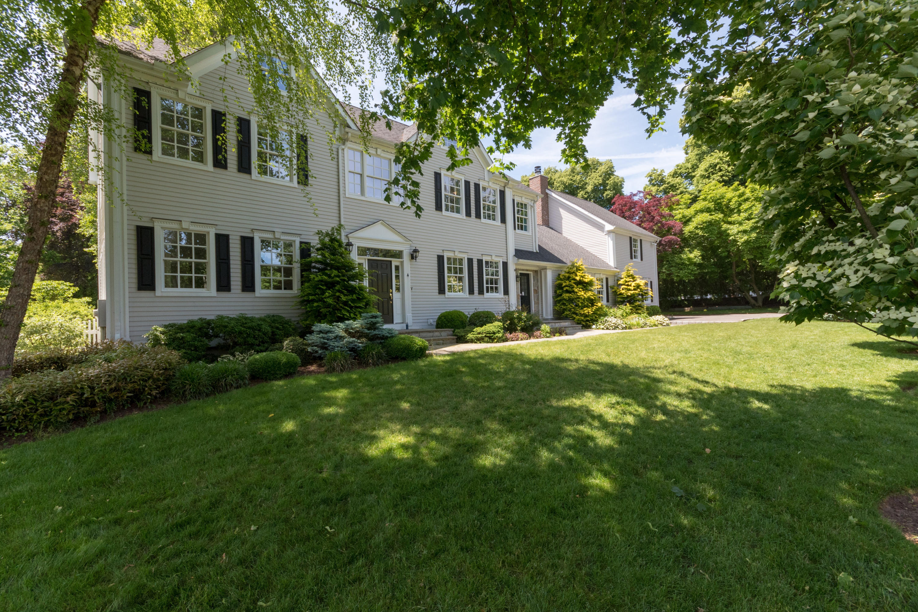 4 Beach Drive Darien, CT 06820 - Photo 3 of 47 a front view of a house with a yard