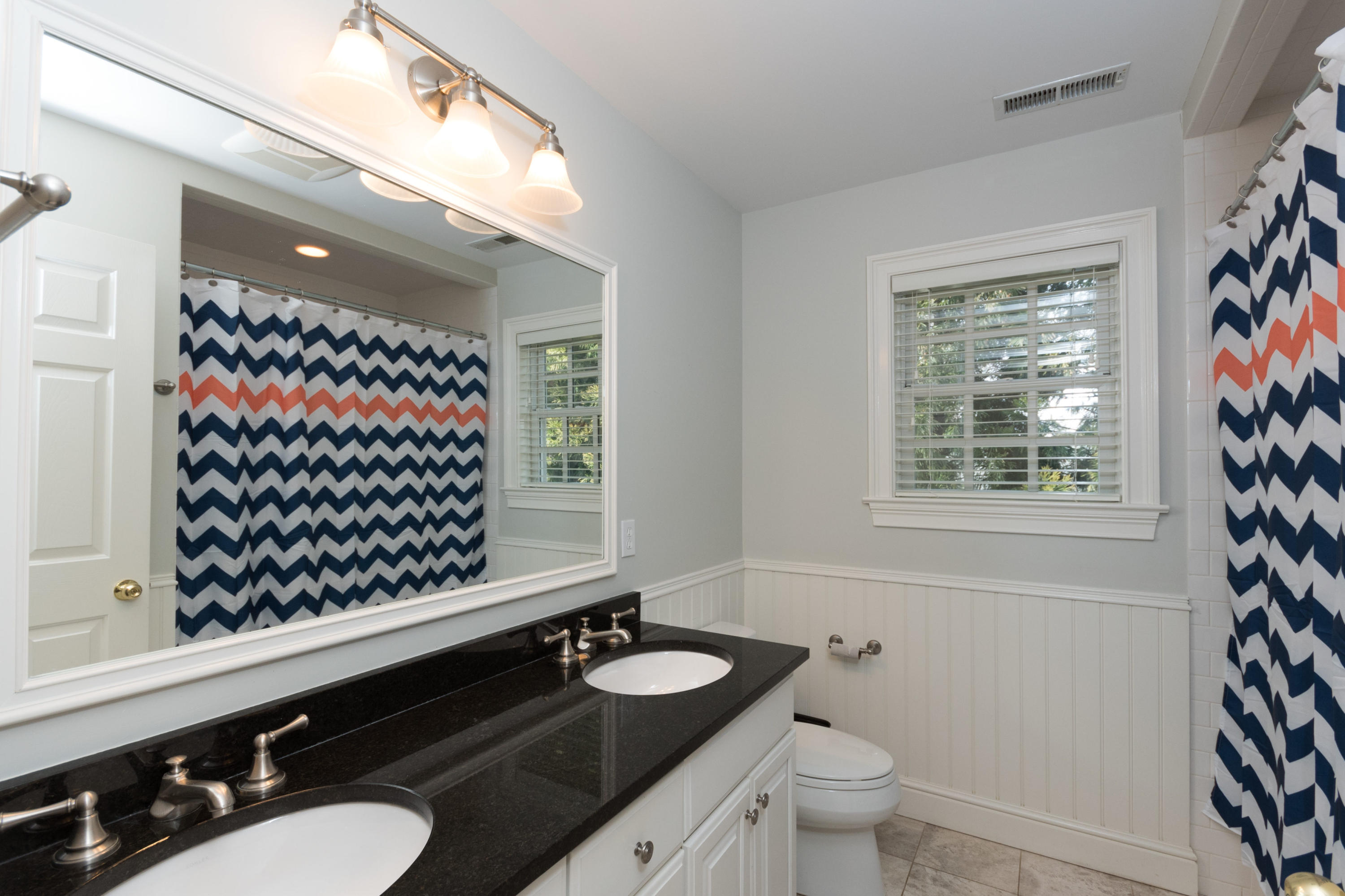 4 Beach Drive Darien, CT 06820 - Photo 34 of 47 a bathroom with a sink a toilet a window and a shower