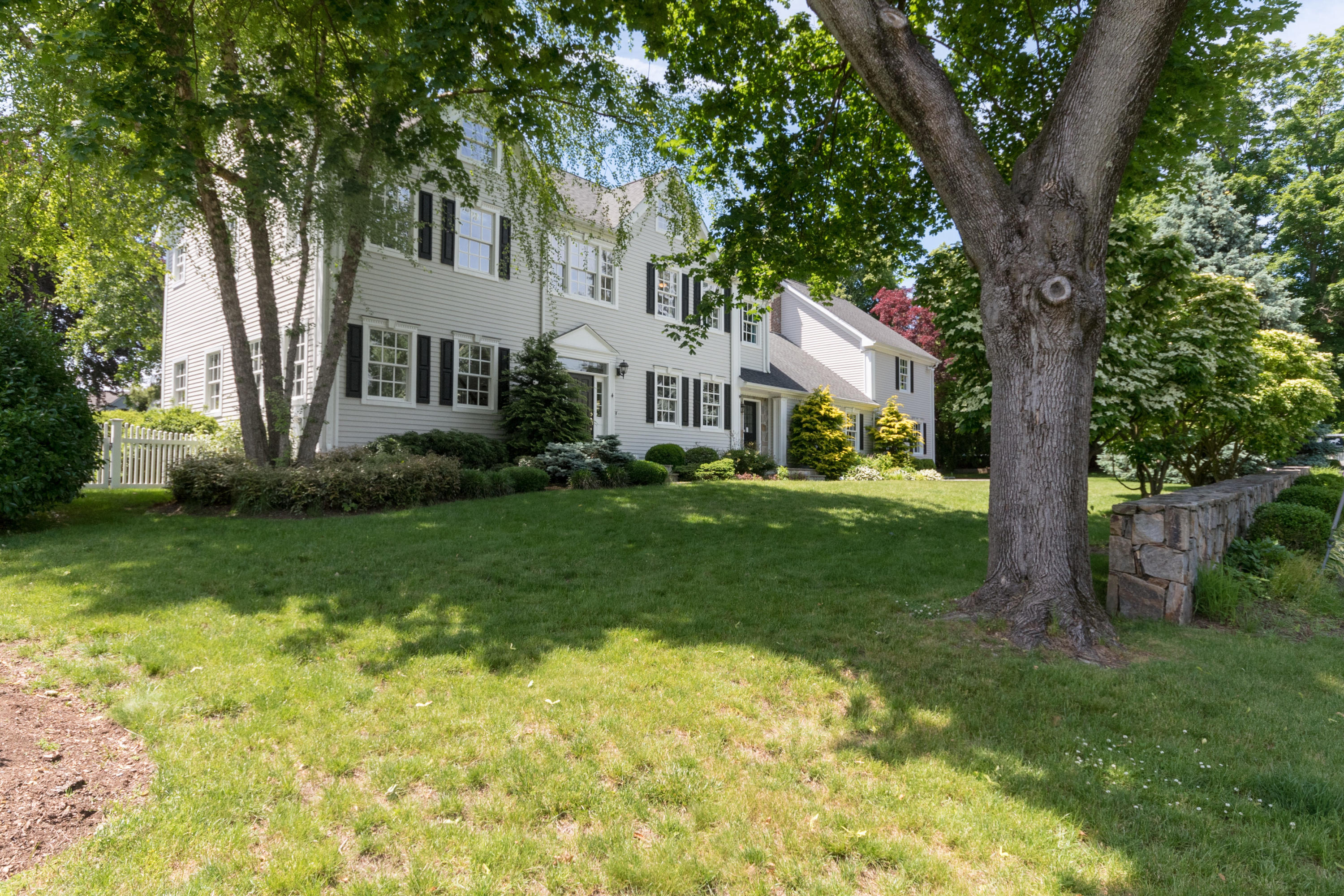 4 Beach Drive Darien, CT 06820 - Photo 36 of 47 a front view of house with yard and green space