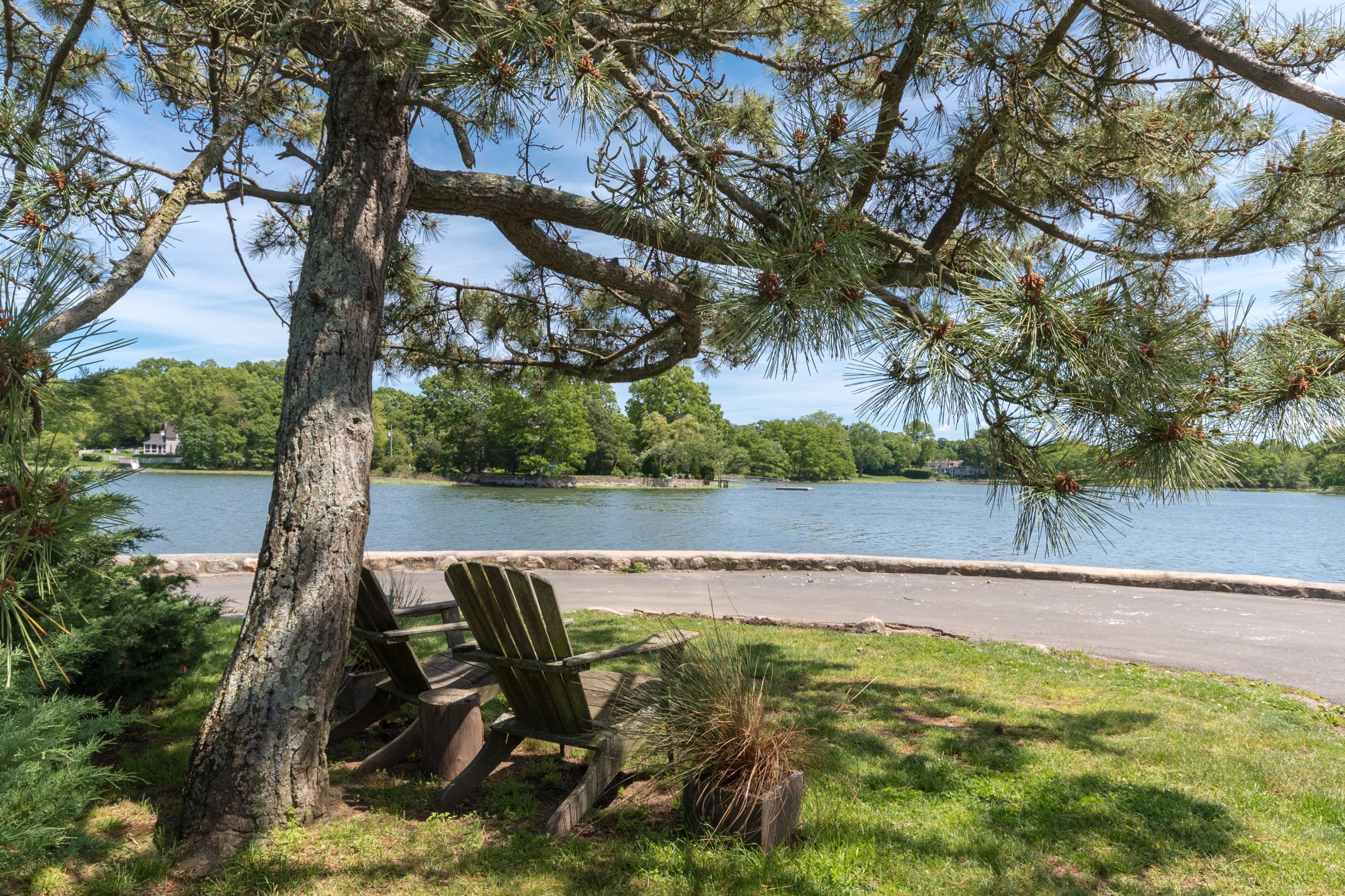 4 Beach Drive Darien, CT 06820 - Photo 39 of 47 a view of a swimming pool with a patio and a yard