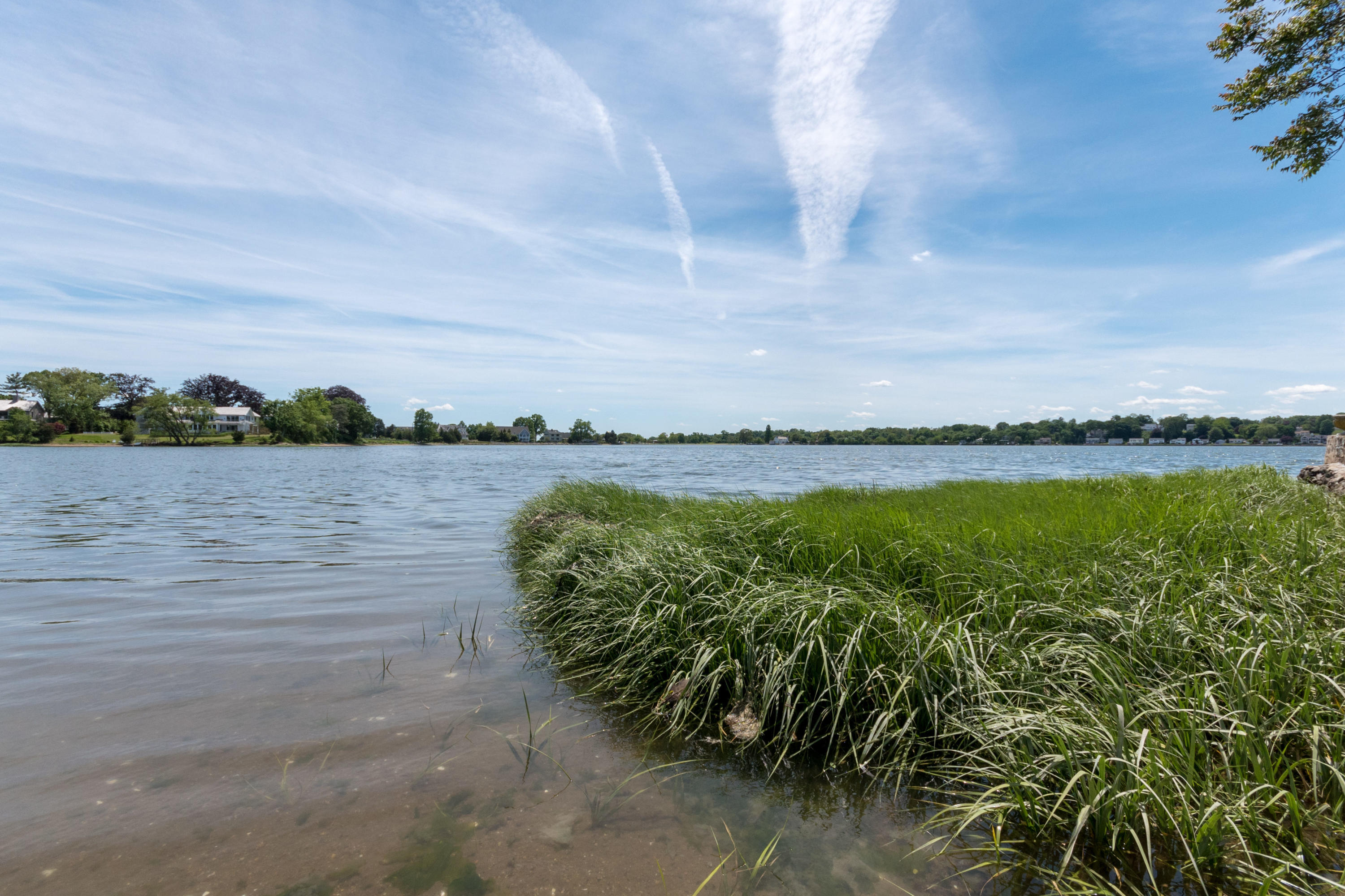 4 Beach Drive Darien, CT 06820 - Photo 41 of 47 a view of a lake with houses in the back