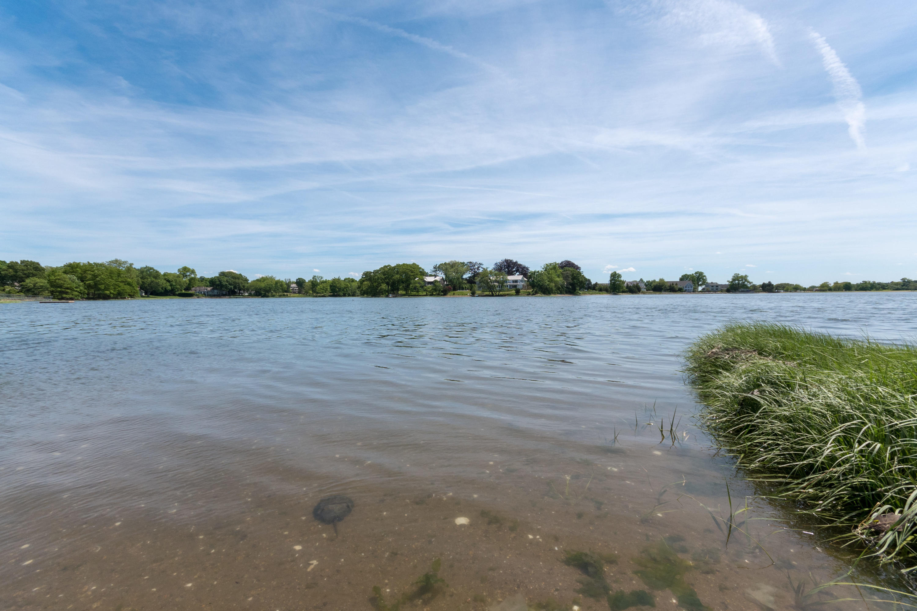 4 Beach Drive Darien, CT 06820 - Photo 42 of 47 a view of a lake with houses in the back