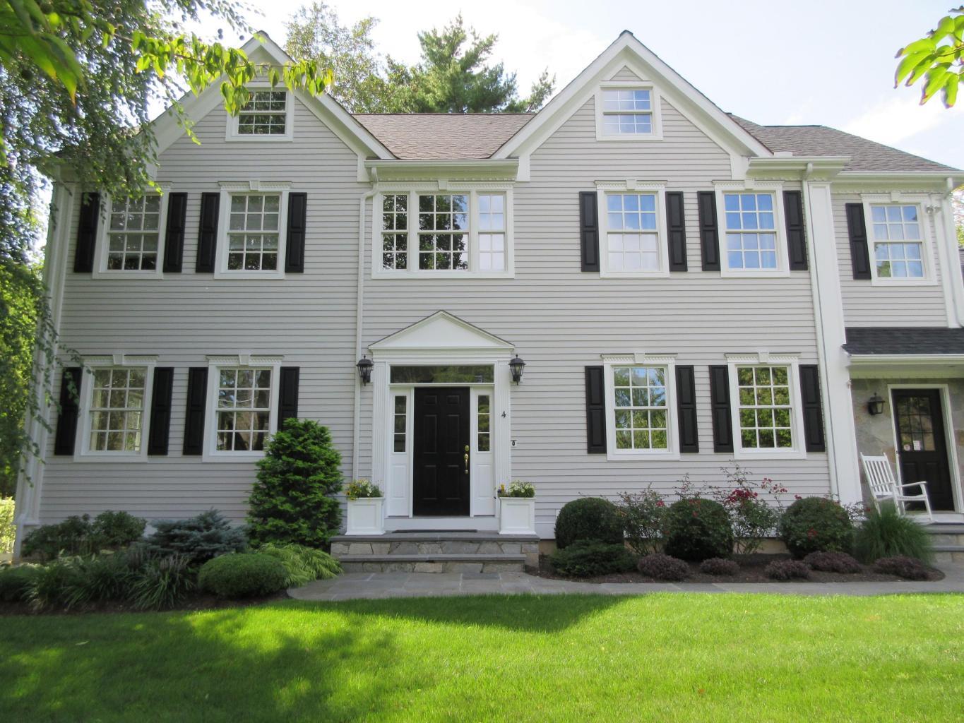 4 Beach Drive Darien, CT 06820 - Photo 46 of 47 a front view of a house with a yard