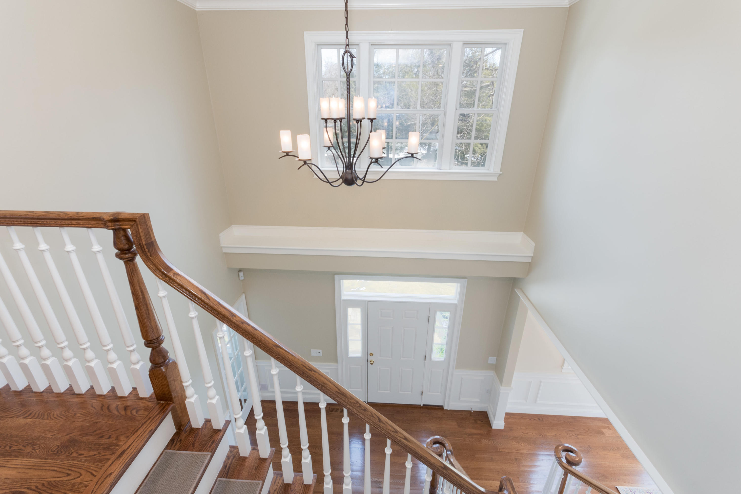 4 Beach Drive Darien, CT 06820 - Photo 5 of 47 a view of a livingroom with wooden floor and stairs