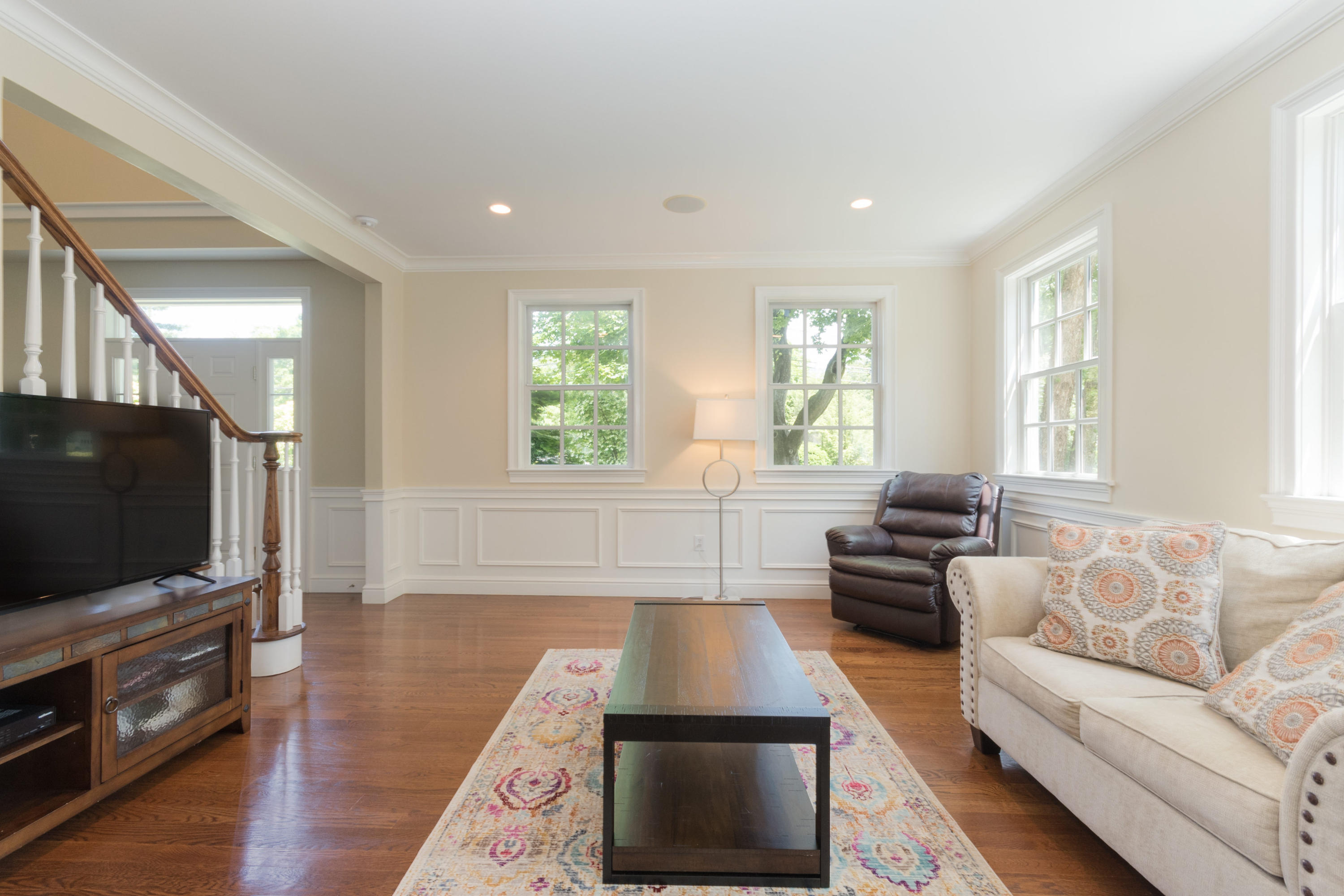 4 Beach Drive Darien, CT 06820 - Photo 9 of 47 a living room with furniture and a flat screen tv