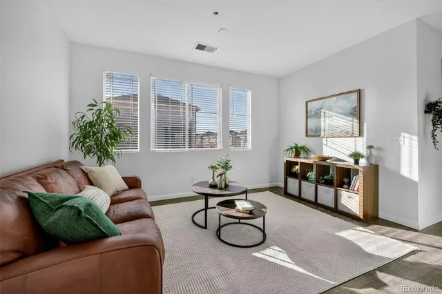 a living room with furniture and window