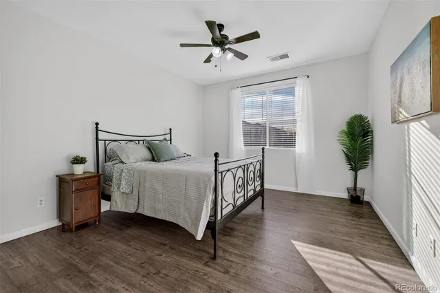 a bedroom with bed and a window