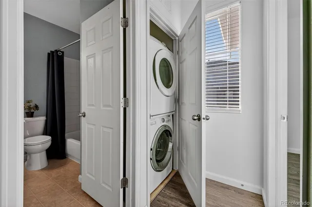 a view of a hallway with washer and dryer
