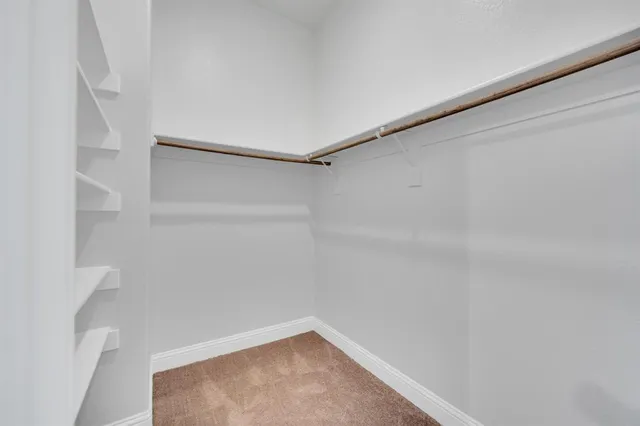 a bathroom with double sink and a mirror