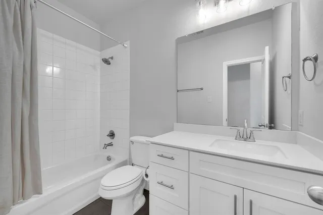 a living room with furniture and a gate