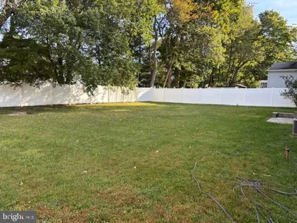 a view of a field with an ocean