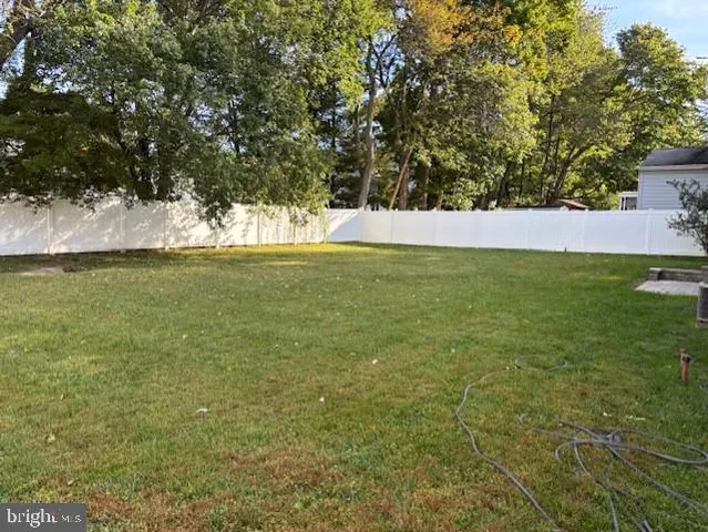 a view of a field with an ocean